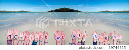 Children Hands Building Word Together We Are Strong, Ocean Background 69744835