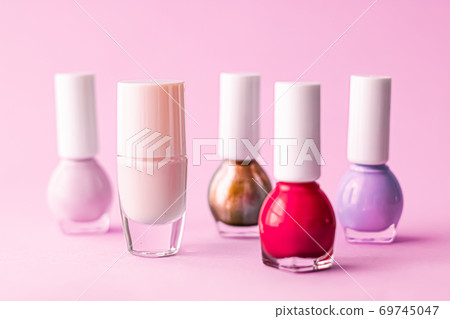 Nail polish bottles on pink background, beauty brand Nail polish bottles on pink background, beauty brand 69745047