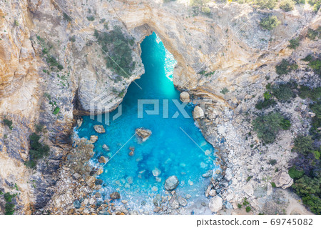 An aerial view of a natural paradise in Antalya, Turkey called hole in the sea. 69745082