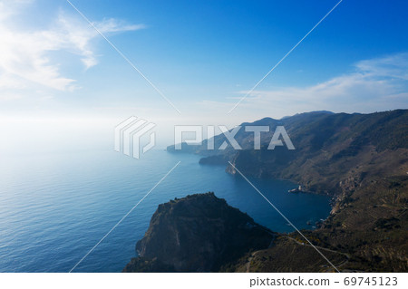 An aerial view of the cove of Gazipasa in Antalya Turkey. Sea and mountains with an open sky. An aerial view of the cove of Gazipasa in Antalya Turkey. Sea and mountains with an open sky. 69745123