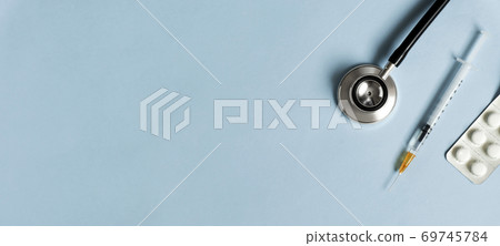 Medical background material and copy space. Stethoscope, syringe and medicine 69745784