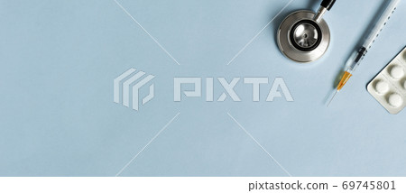 Medical background material and copy space. Stethoscope, syringe and medicine 69745801