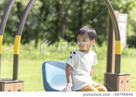 Boy resting on the bench Boy resting on the bench 69746948