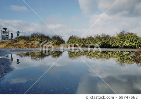 American highway stagnant water reflects the sky American highway stagnant water reflects the sky 69747668