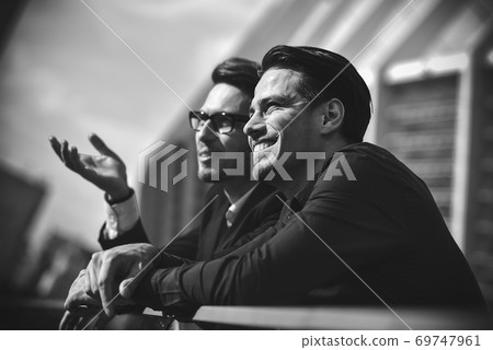 Two awesome business man have a rest between a work. 69747961