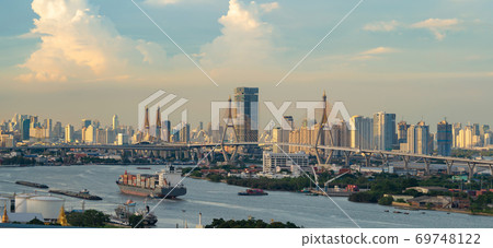 Aerial view of Bhumibol Bridge and Chao Phraya River in structure of suspension architecture concept, Urban city, Bangkok. Downtown area at sunset, Thailand. Aerial view of Bhumibol Bridge and Chao Phraya River in structure of suspension architecture concept, Urban city, Bangkok. Downtown area at sunset, Thailand. 69748122