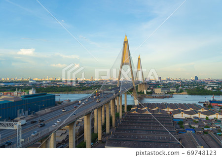 Aerial view of Bhumibol Bridge and Chao Phraya River in structure of suspension architecture concept, Urban city, Bangkok. Downtown area at sunset, Thailand. Aerial view of Bhumibol Bridge and Chao Phraya River in structure of suspension architecture concept, Urban city, Bangkok. Downtown area at sunset, Thailand. 69748123