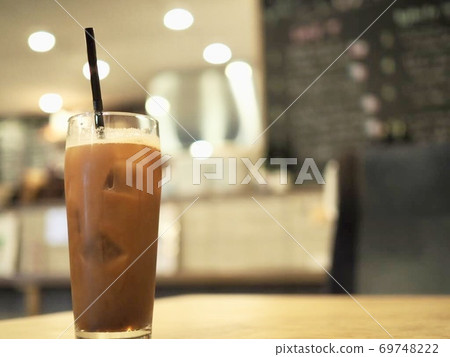 Enjoy iced coffee at the cafe Enjoy iced coffee at the cafe 69748222
