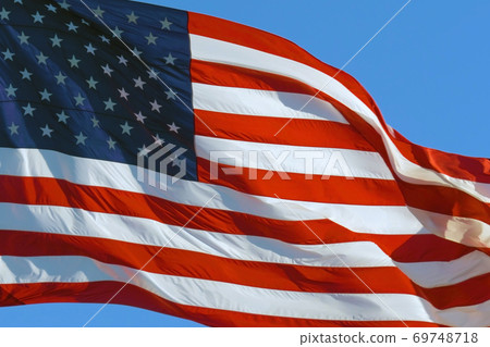American Flag Waving in the Wind 69748718