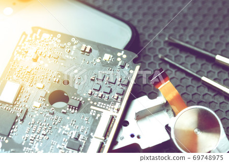 repair electronic equipment on dark background with copy space, repairing electronics concept repair electronic equipment on dark background with copy space, repairing electronics concept 69748975