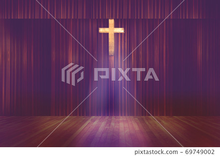 wooden cross on red curtain background in small church 69749002