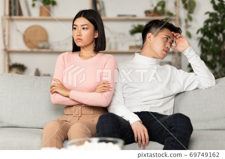 Asian Couple After Quarrel Not Talking Sitting Offended At Home Asian Couple After Quarrel Not Talking Sitting Offended At Home 69749162