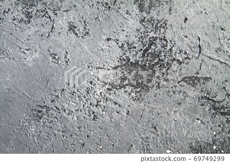 Concrete dark gray background with scuffs and black splashes. Textured wall texture in the grunge style. Concrete dark gray background with scuffs and black splashes. Textured wall texture in the grunge style. 69749299