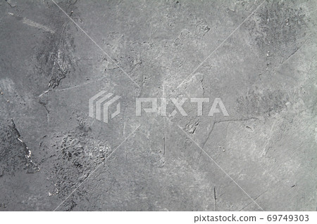 Concrete dark gray background with scuffs and black splashes. Textured wall texture in the grunge style. Concrete dark gray background with scuffs and black splashes. Textured wall texture in the grunge style. 69749303