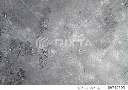Concrete dark gray background with scuffs and black splashes. Textured wall texture in the grunge style. Concrete dark gray background with scuffs and black splashes. Textured wall texture in the grunge style. 69749305