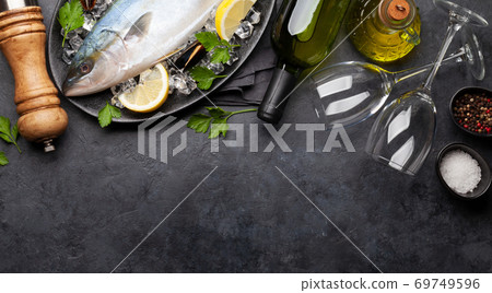 Raw fish cooking. Seafood and ingredients 69749596