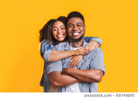 Happy In Relationship. Portrait of smiling black girl and her handsome boyfriend Happy In Relationship. Portrait of smiling black girl and her handsome boyfriend 69749895