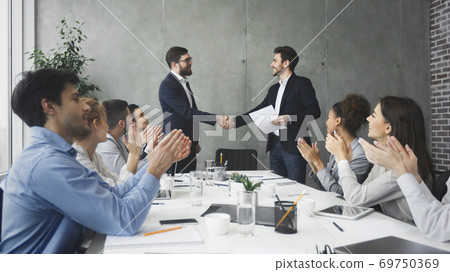 Striking grand deal. Business people congratulating their colleagues 69750369