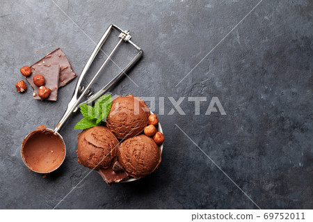 Chocolate with nuts ice cream scoops Chocolate with nuts ice cream scoops 69752011