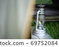 Oil lantern lit through a tent on a summer day 69752084