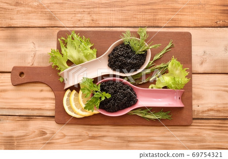 Black caviar with fresh herbs Black caviar with fresh herbs 69754321