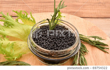 Black caviar with fresh herbs Black caviar with fresh herbs 69754322