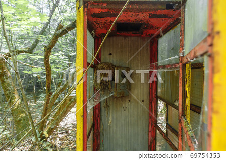 Abandoned phonebox in ghost town Pripyat Chornobyl Zone 69754353