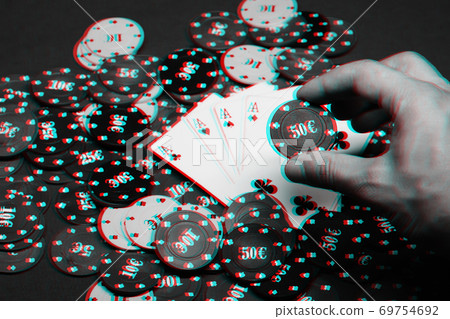 four of a kind of aces on a pile of gaming chips on the green table in the casino close-up four of a kind of aces on a pile of gaming chips on the green table in the casino close-up 69754692