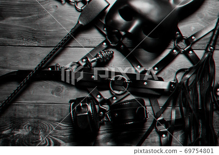 set of sex toys for hard BDSM sex with domination and submission. Leather whip, handcuffs, belt 69754801