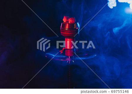 hookah red hot coals for shisha in a bowl against a background of smoke hookah red hot coals for shisha in a bowl against a background of smoke 69755146