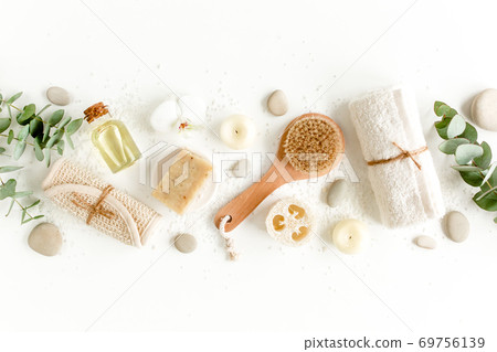 Spa Background. Natural, Organic spa cosmetics products, eco friendly bathroom accessories, eucalyptus leaves. Skincare concept on white background.  69756139