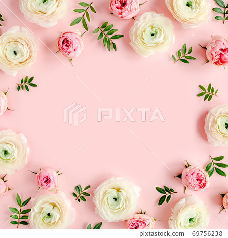 Floral background frame made of pink ranunculus and roses flower buds on pink background. Flat lay, top view floral background. Floral background frame made of pink ranunculus and roses flower buds on pink background. Flat lay, top view floral background. 69756238