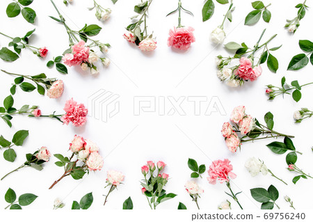 frame made of beautiful pink roses and eucalyptus branches on a white background. The apartment lay, top view. Floral frame. Frame of flowers. frame made of beautiful pink roses and eucalyptus branches on a white background. The apartment lay, top view. Floral frame. Frame of flowers. 69756240