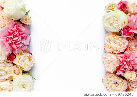 The workspace of pink and beige roses buds isolated on white wooden background. The apartment lay, top view. Frame of flowers. Floral background. The workspace of pink and beige roses buds isolated on white wooden background. The apartment lay, top view. Frame of flowers. Floral background. 69756243