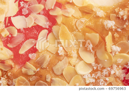 Spanish typical Epiphany cake Roscon de Reyes with fruit, background 69756963