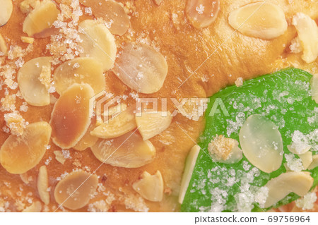 Spanish typical Epiphany cake Roscon de Reyes with fruit, background Spanish typical Epiphany cake Roscon de Reyes with fruit, background 69756964
