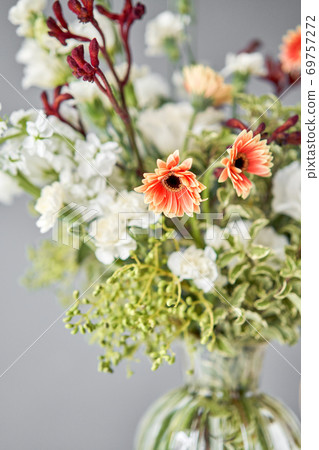 Series, step by step installation of flowers in a vase. Flowers bunch, set for home. Fresh cut flowers for decoration home. European floral shop. Delivery fresh cut flower. 69757272