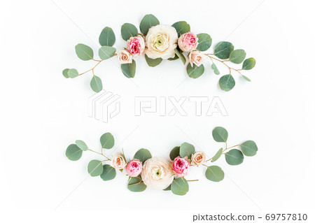 Wreath frame made of branches eucalyptus, pink roses and leaves isolated on white background. lay flat, top view Wreath frame made of branches eucalyptus, pink roses and leaves isolated on white background. lay flat, top view 69757810