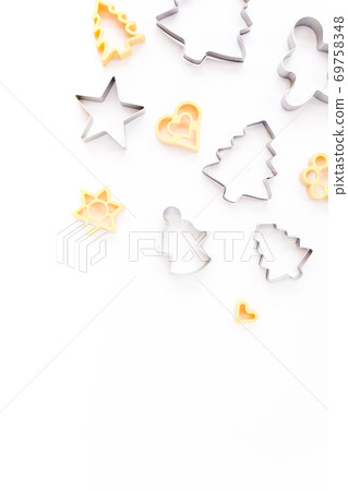 Christmas baking molds on white background. Flat lay, top view bakery composition. Christmas baking molds on white background. Flat lay, top view bakery composition. 69758348