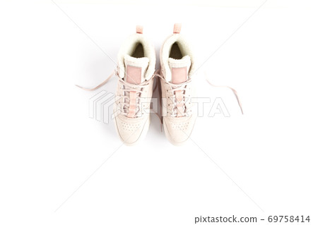 Pink female sneakers on white background. Flat lay, top view minimal background. Fashion blog or magazine concept. Pink female sneakers on white background. Flat lay, top view minimal background. Fashion blog or magazine concept. 69758414