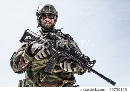 Private military company mercenary with gun 69759159