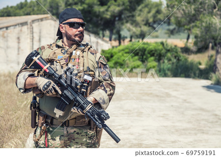 Portrait of equipped, armed US Navy SEALs fighter 69759191