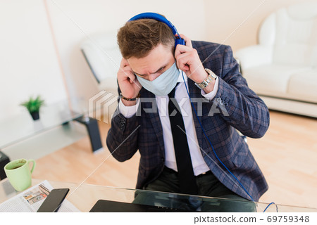 Photo of young businessman with notebook freelance job internet, medical mask Photo of young businessman with notebook freelance job internet, medical mask 69759348