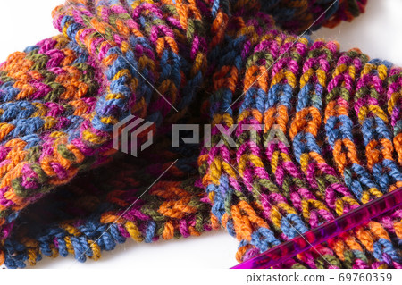 Soft warm handmade woolen scarf and a knitting needle Soft warm handmade woolen scarf and a knitting needle 69760359