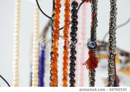 Gemstone and pearl necklaces in a jewellery shop 69760593