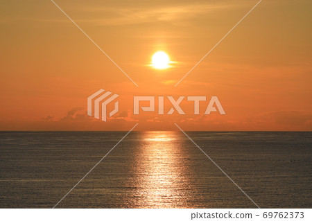 Evening view of the Sea of Japan on Sado Island, the midsummer dusk sun 69762373