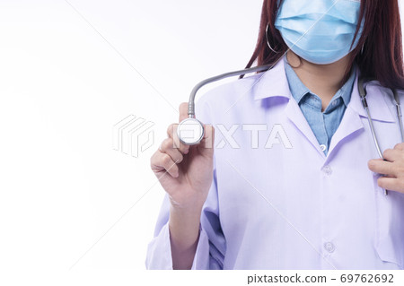 Close up hand of young woman doctor or nurse wear coat uniform and face mask 69762692