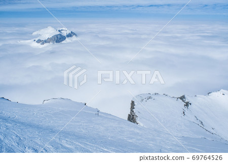 Stunning Panoramic view Snow moutain of the Swiss Skyline from Schilthorn Piz Gloria, Switzerland Stunning Panoramic view Snow moutain of the Swiss Skyline from Schilthorn Piz Gloria, Switzerland 69764526