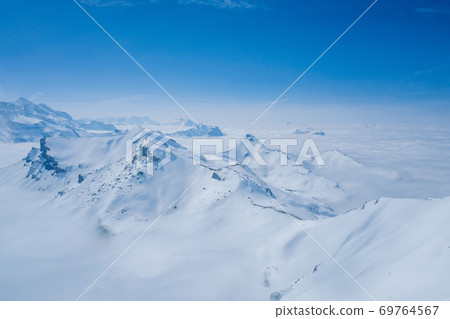 Stunning Panoramic view Snow moutain of the Swiss Skyline from Piz Gloria Schilthorn, Switzerland Stunning Panoramic view Snow moutain of the Swiss Skyline from Piz Gloria Schilthorn, Switzerland 69764567
