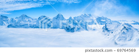 Stunning Panoramic view Snow moutain of the Swiss Skyline from Schilthorn, Switzerland Stunning Panoramic view Snow moutain of the Swiss Skyline from Schilthorn, Switzerland 69764569